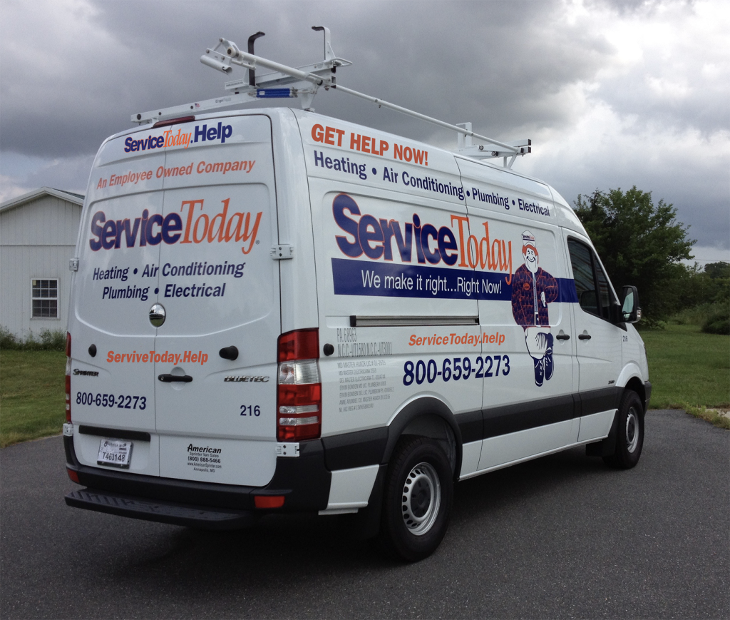 Service Today truck parked outside on a cloudy day.